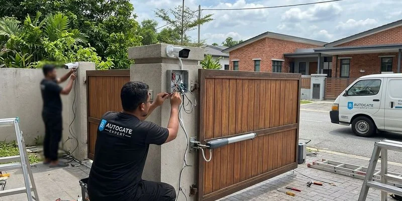 Smartphone showing live CCTV feed with autogate open notification alert