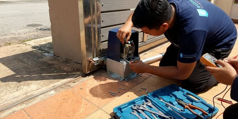 Professional technician working on autogate motor and control panel wiring