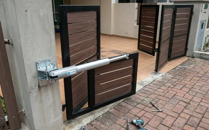 Swing arm motors mounted on gate pillars showing dedicated arms for each folding gate segment